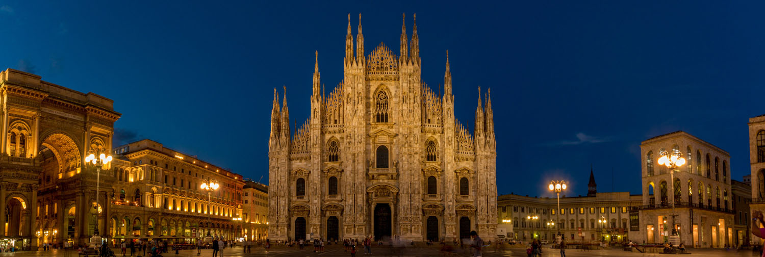 Milan Duomo illuminated at dusk in Piazza del Duomo