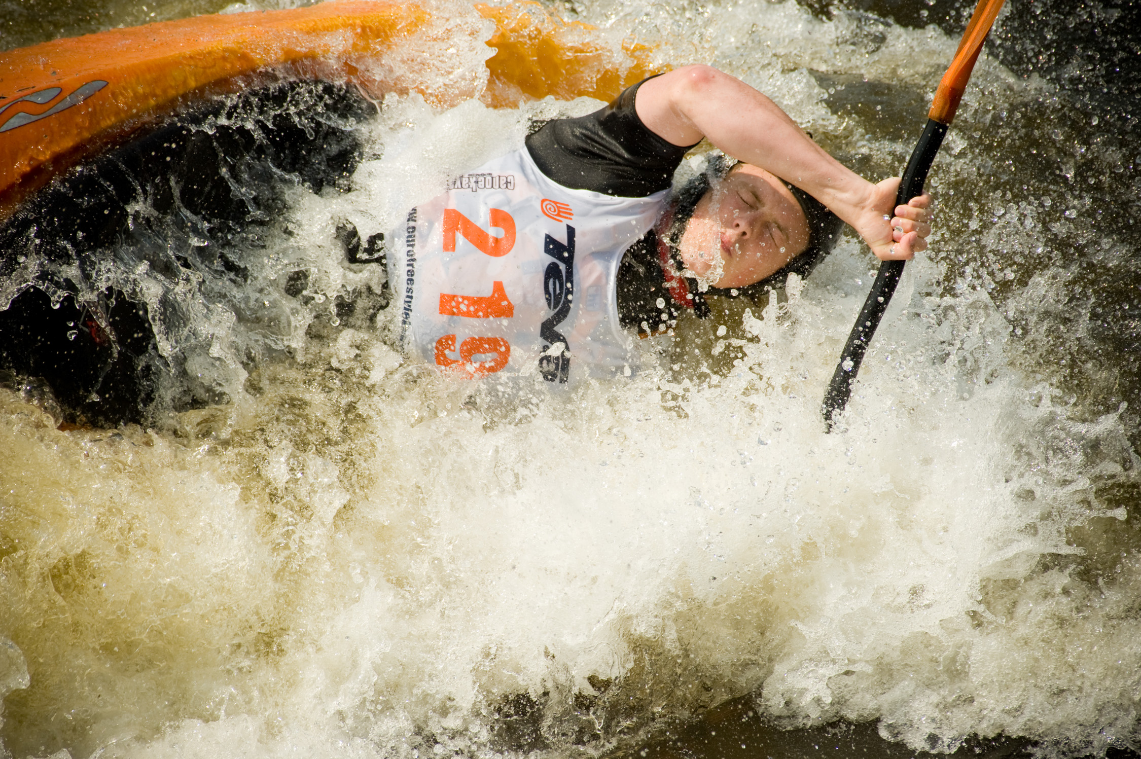 Capturing the action using a telephoto lens.