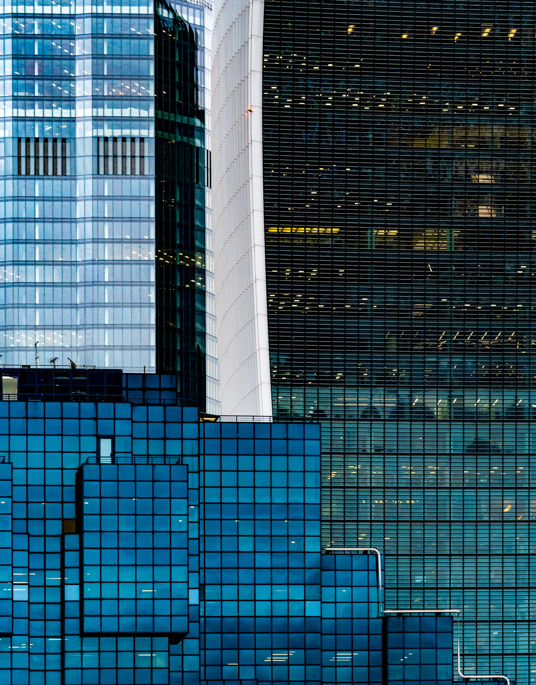 The use of a telephoto lens compresses perspective making the buildings appear closer together.